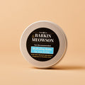 Barking Mad Meowson balm container on a beige background