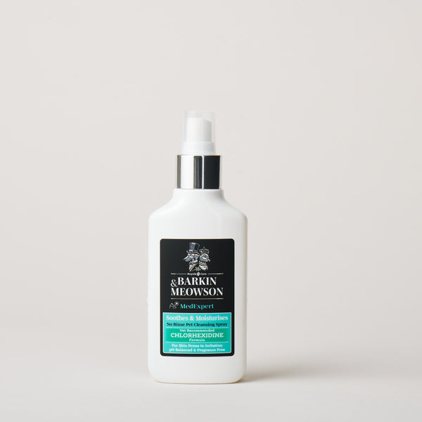 White bottle with a black label on a light gray background