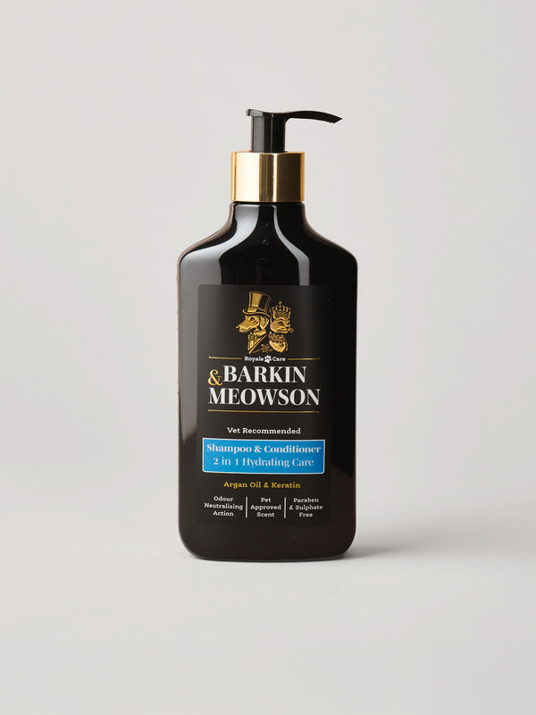 A black pump bottle of Barkin Meowson Shampoo & Conditioner with a gold collar and black label, set against a light gray background.
