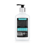 White bottle with pump and label on a white background