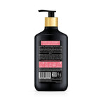 Black shampoo bottle with gold pump on a white background