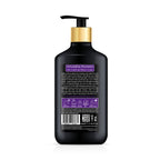 Black shampoo bottle with gold pump on a white background