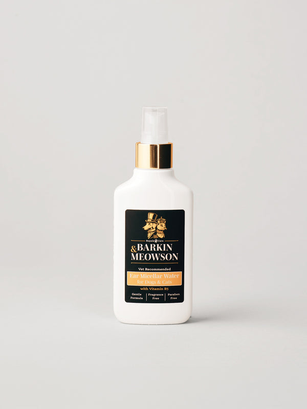 A white bottle of Barkin & Meowson ear micellar water spray with a gold collar and clear spray nozzle, set against a light gray background.