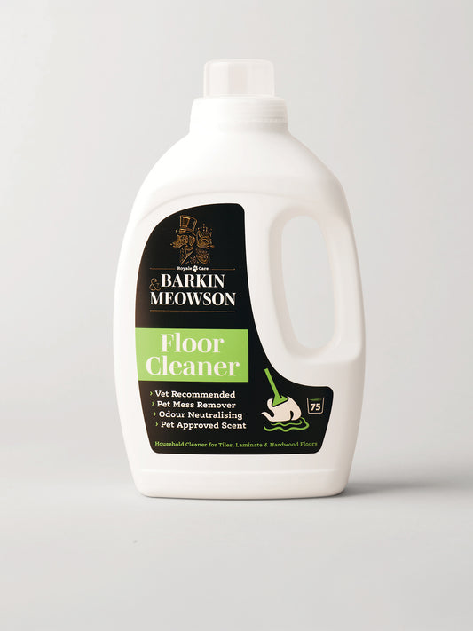 A white plastic bottle of Barkin Meowson Floor Cleaner with a black and green label, photographed on a light gray background.