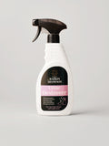 A white spray bottle of Barkin & Meowson Urine Destroyer, featuring a black trigger sprayer and a label with black and pink sections, set against a plain light gray background.