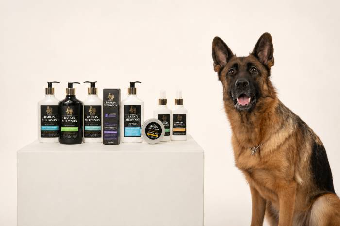 German Shepherd sitting beside Barkin & Meowson high quality pet products and grooming essentials.